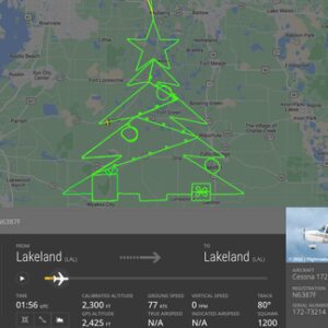 Avião desenha desenho Árvore de Natal voo