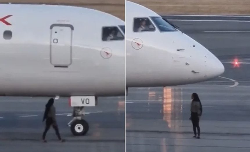 Woman boarding Qantas Link flight